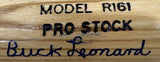 Close-up of a tan Louisville Slugger bat by Sports Integrity, featuring the Buck Leonard Homestead Grays signature and JSA authentication.