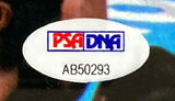 Close-up of a PSA/DNA sticker with ID AB50293 on the Sports Integrity Buster Douglas Signed Framed 8x10 Mike Tyson Knockout Photo.