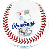 A close-up of a Cal Raleigh Seattle Mariners Signed Official MLB Baseball by Sports Integrity shows red stitching, blue Rawlings text, and two authentication stickers with QR codes and serial numbers.