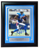 Calvin Johnson Signed Framed 8x10 Detroit Lions Photo by Sports Integrity, featuring him in a blue uniform running with the ball; autographed and includes plaque: Calvin Johnson, Detroit Lions #81, Hall of Fame 2021. JSA certified.