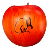 The Sports Integrity Carlito Signed WWE Plastic Prop Apple features a bold black autograph across its red and orange-streaked surface and comes with a JSA QR Hologram for authenticity.