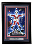 The Sports Integrity Chevy Chase Signed Framed 11x17 Lampoon’s Christmas Vacation Photo features a scene of a man in a Santa suit struck by electricity with flying gifts. The frame includes a nameplate reading Chevy Chase Clark Griswold.