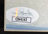 A Christian Bale Signed Framed 8x10 American Psycho Photo by Sports Integrity features an oval sticker with a holographic JSA logo, bold black code CD44143, and a cursive signature on a white background in the corner.