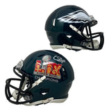 Two dark green Philadelphia Eagles mini helmets by Sports Integrity, both with black facemasks. One has a silver eagle wing, the other is signed by CJ Gardner-Johnson with “Super Bowl 59 LIX Champions” and comes with BAS authentication.