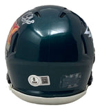 The Sports Integrity CJ Gardner-Johnson Signed Philadelphia Eagles Super Bowl 59 LIX mini helmet is dark green, seen from the back with a white warning label, round authenticity sticker, and a white signature on the upper left.