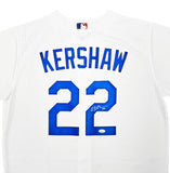 The Sports Integrity Clayton Kershaw Signed Los Angeles Dodgers Nike Baseball Jersey (JSA LOA) is white with "Kershaw" and blue number 22—signature inside the second digit—and an MLB logo at the top.