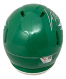 The Cooper DeJean Signed Philadelphia Eagles Kelly Green Mini Speed Helmet by Sports Integrity is shown from the back, with a visible barcode sticker and a large white autograph on the top right.