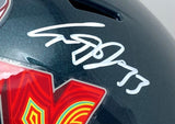 A close-up of the Cooper DeJean Signed Eagles Super Bowl 59 LIX FS Replica Speed Helmet by Sports Integrity showcases a bold white autograph with number 73 and part of a red and yellow decal in the lower left corner.
