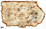 The Corey Feldman Signed 11x17 The Goonies Map Photo by Sports Integrity features a vintage-style map with nautical markings, compass roses, and bold black Corey Feldman signatures inscribed "God Bless" on the right side. BAS authenticated.