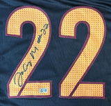 Close-up of a Jacory Croskey-Merritt Washington Black Football Jersey by Sports Integrity, featuring large yellow number 22 outlined in red. The left 2 is autographed in black marker, including the number 22 in the signature.