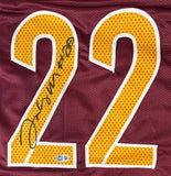 A Jacory Croskey-Merritt Washington burgundy football jersey by Sports Integrity, featuring a large yellow number 22 outlined in white with his autograph on the left-side "2". BAS authenticated.