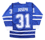 This Sports Integrity Curtis Joseph Toronto blue hockey jersey features "JOSEPH" and #31 on the back, with his signature on the number. JSA authenticated.