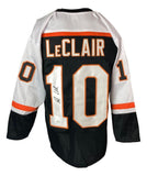 The Sports Integrity John Leclair Philadelphia Signed Black Hockey Jersey (JSA) features black, white, and orange colors, with “LeClair” and signed #10 on the back.