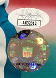 Close-up of Dan Marino Signed Framed 8x10 Miami Dolphins Photo by Sports Integrity—shows a white JSA sticker with AK32012 and a round NFL hologram with helmets, NFL logo, and Official Licensed Product NF15248496.