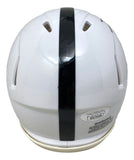 The Sports Integrity Dani Dennis-Sutton Signed Penn State Mini Speed Helmet We Are JSA is white with a thick black center stripe, multiple ventilation slits, and a visible warning label near the bottom edge.