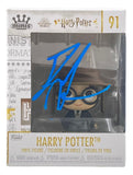 A Daniel Radcliffe signed Harry Potter Mini Funko Pop #91 by Sports Integrity, in box with the front signed in large blue marker. Features Harry Potter with glasses and a wizard hat.