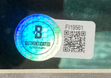 A holographic B Authenticated Autograph sticker is next to a white FI19561 label with QR code on a Sports Integrity Batista Dave Bautista Signed Framed 16x20 Guardians Of The Galaxy Drax Photo BAS; background is blurred.