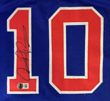 A blue Sports Integrity jersey displays a red and white number 10, with Dennis Rodman's autograph on the left digit and a BAS authentication sticker at the bottom.