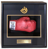 The Sports Integrity Deontay Wilder Signed Red Everlast Right Hand Boxing Glove Shadowbox BAS features a framed display with his signature, a gold and black champion plaque, and a gold logo at the top.