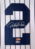 Sports Integrity’s Derek Jeter Signed Framed Yankees Majestic Jersey features a navy #2 on white with dark stripes, silver autograph, 09 WS and Stadium patches, plus two authenticity stickers below the signature.