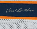 A close-up of the Sports Integrity Dick Butkus Signed Custom White Pro Style Football Jersey JSA ITP shows a blue and orange stripe with a silver autograph on the blue section. The lower white jersey features small ventilation holes.