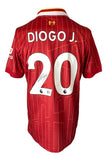 A red Diogo Jota Liverpool Nike soccer jersey from Sports Integrity with gold pinstripes, white and yellow collar details, "DIOGO J." and signed number 20 on the back. BAS authenticated.