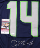 The Sports Integrity DK Metcalf Seattle Signed Blue Football Jersey features a large light gray number 14 outlined in green, Metcalf’s signature at the bottom, and an attached JSA authentication card on the left side.