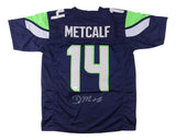 The Sports Integrity DK Metcalf Seattle Signed Blue Football Jersey JSA features green and white accents, METCALF’s name, number 14, and a white signature near the bottom of the number.