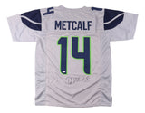 A gray DK Metcalf Seattle football jersey by Sports Integrity, featuring METCALF and number 14 in blue and green, signed on the lower part of the jersey. JSA authenticated.