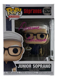 The Sports Integrity Dominic Chianese Signed The Sopranos Junior Soprano Funko Pop #1523 BAS features Junior Soprano in box, with the clear packaging signed in pink marker by Dominic Chianese.