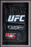 The Sports Integrity Dustin Poirier Signed UFC Fight Glove features a silver signature, white UFC logo, and red/white patch, all displayed in a black and red shadowbox frame. BAS authenticated.