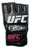 A black Dustin Poirier signed UFC fight glove by Sports Integrity, featuring “The Diamond” inscription, a white UFC logo, autograph on the back, and a red-and-white UFC patch on the wrist strap.