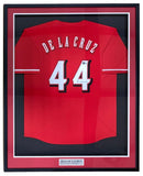 The Sports Integrity Elly De La Cruz Cincinnati Signed Framed Red Baseball Jersey features his name and number 44, an autograph near the number, a display plaque, and protective glass. Authenticated by BAS.