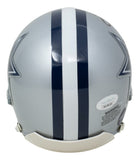 The Emmitt Smith Signed Dallas Cowboys Mini Replica Helmet by Sports Integrity features a silver finish, thick dark blue vertical stripe bordered by white, partial star designs, and visible labels—an iconic piece of sports memorabilia.