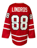 The Sports Integrity Eric Lindros Canada Signed Red Hockey Jersey features white stripes, "Lindros" and #88 on back and sleeves, plus an autograph with "HOF 16" inscribed inside one of the eights. JSA ITP authenticated.