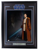 The Sports Integrity Ewan McGregor Signed Framed 16x20 Star Wars Obi-Wan Kenobi Collage Photo (JSA) features an image of Obi-Wan with a blue lightsaber, McGregor's signature, a nameplate, and the Star Wars logo on top.