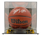 The Sports Integrity Patrick Ewing New York Knicks Signed NBA Wilson I/O Basketball is showcased in a clear glass case with a mirrored back and gold base supports.