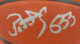 Close-up of a Patrick Ewing New York Knicks Signed NBA Wilson I/O Basketball by Sports Integrity, featuring two large, stylized white autographs across the textured orange surface. Includes BAS authentication and display case.