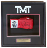 The Sports Integrity shadowbox displays a Floyd Mayweather Jr signed red Cleto Reyes RH boxing glove with the TMT logo above and a plaque below reading “Floyd Money Mayweather Jr. Undefeated, The Best Ever.”.