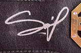 Close-up of Francis Ngannou’s white autograph on black textured material with stitching, part of a gold plate visible; Sports Integrity UFC Replica Full Size Championship Belt.