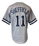 The Gary Sheffield New York gray baseball jersey by Sports Integrity features blue and white striped sleeves, "SHEFFIELD" and number 11 on the back, with the number 11 autographed.