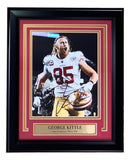 This Sports Integrity George Kittle Signed Framed 8x10 San Francisco 49ers Photo (#85), authenticated by PSA/DNA hologram, shows him in uniform holding a helmet and shouting, with a name plaque below.