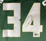 The Giannis Antetokounmpo Signed Milwaukee Bucks Nike Swingman Jersey by Sports Integrity features a green design, bold white and gold number 34, black autograph on the 4, and a certification sticker below the signature.