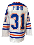 The Sports Integrity Grant Fuhr Edmonton Signed White Hockey Jersey JSA features blue and orange stripes, FUHR on the upper back, number 31 below, and signatures on the left side of the number.