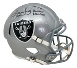 The Sports Integrity Howie Long Signed Oakland Raiders FS Replica Speed Helmet features the Raiders logo, gray facemask, and is autographed with "Raider Nation" inked on top.