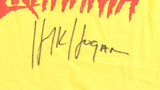 The Sports Integrity Hulk Hogan Signed WWE Hulkamania Yellow T-Shirt features "Hulkamania" in red at the top and Hulk Hogan's black autograph below.