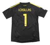 The Sports Integrity Iker Casillas Signed Real Madrid Black Adidas Soccer Jersey BAS features short sleeves, yellow shoulder accents, “I. Casillas” and number 1 on the back, plus a signature below the number.