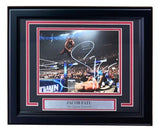 Sports Integrity’s Jacob Fatu Signed In White Framed 8x10 WWE Photo features Fatu mid-air in the ring, performing a move. The autographed image is PSA/DNA authenticated and labeled “JACOB FATU ‘The Samoan Werewolf.’”.