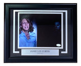 Jamie Lee Curtis Signed Framed 8x10 Halloween Photo by Sports Integrity, featuring her looking frightened with Michael Myers in the shadows. Includes JSA authentication and a plaque reading JAMIE LEE CURTIS Halloween.