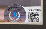 Close-up of a Beckett authentication sticker (serial BB36606) on a Jason Alexander Signed Framed 8x10 Seinfeld Photo by Sports Integrity, showing the holographic “B” logo and QR code on a white background.